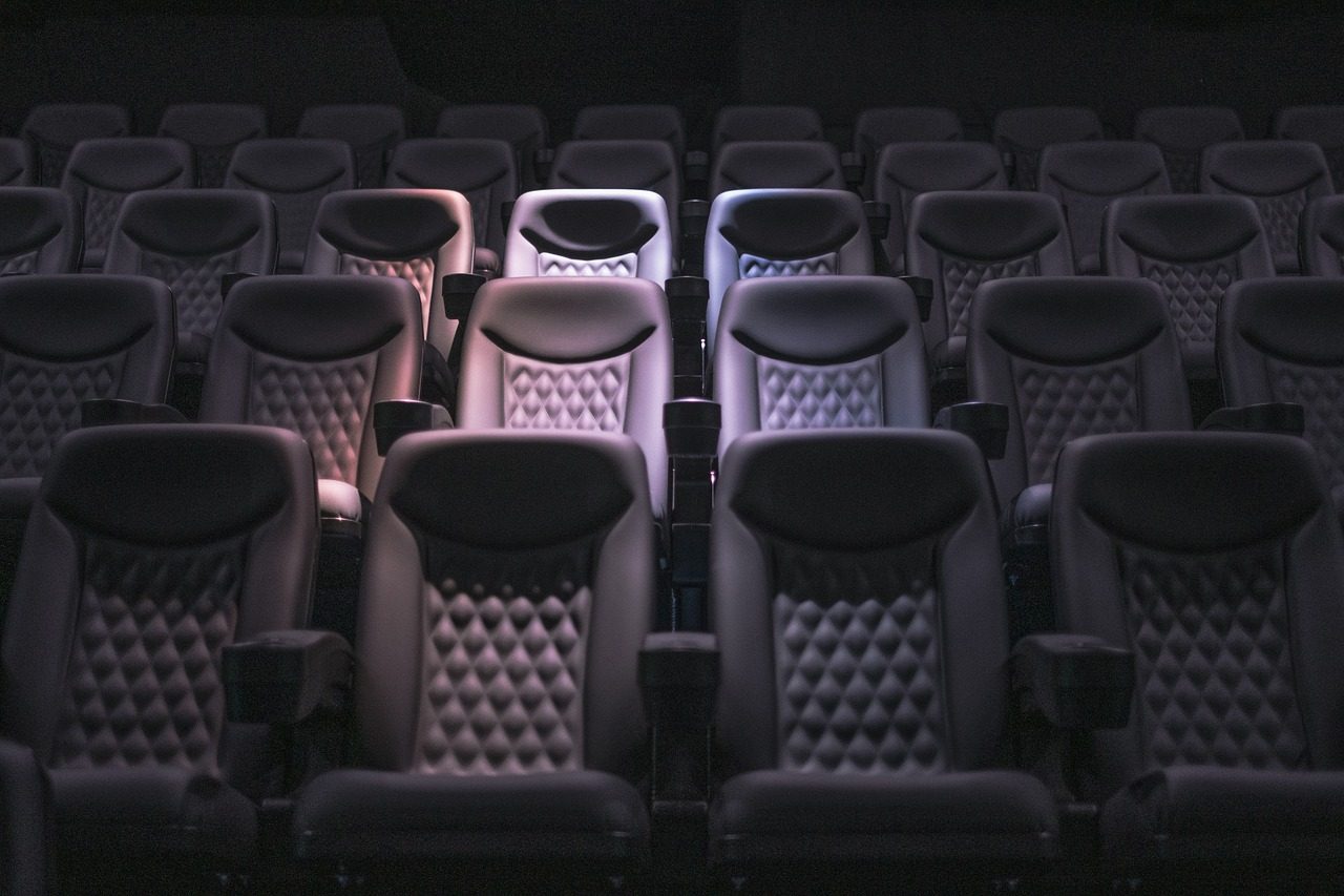 empty cinema auditorium with red seats